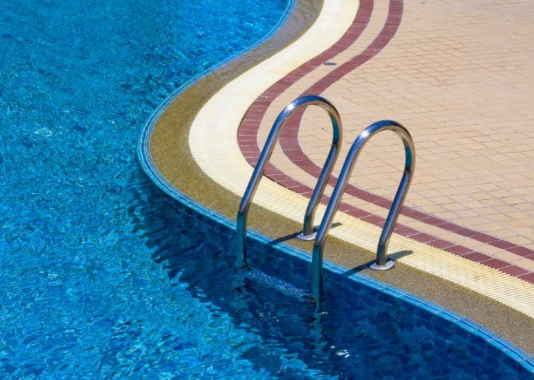 What Really Keeps Commercial Pools Clean, According to a Commercial Pool Service
